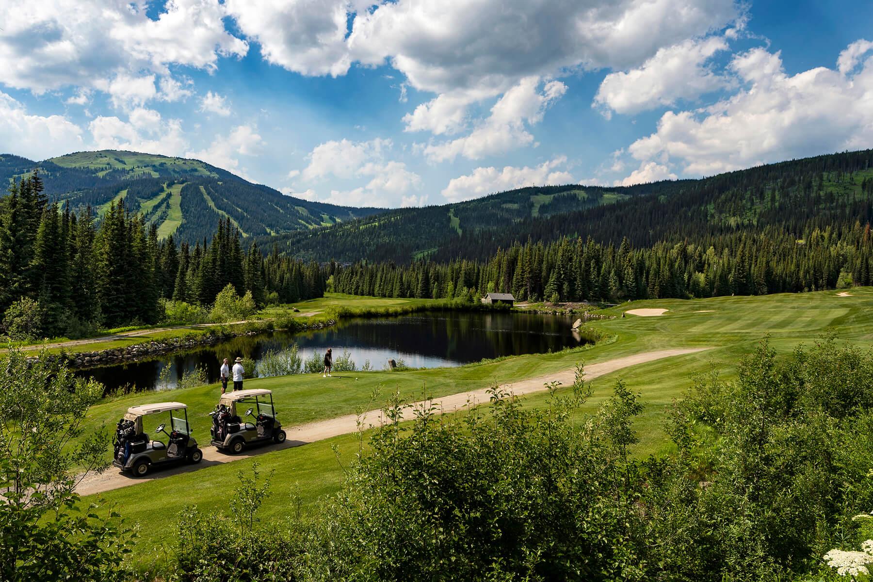 Golfers teeing off on Hole 13 at Sun Peaks Golf Course
